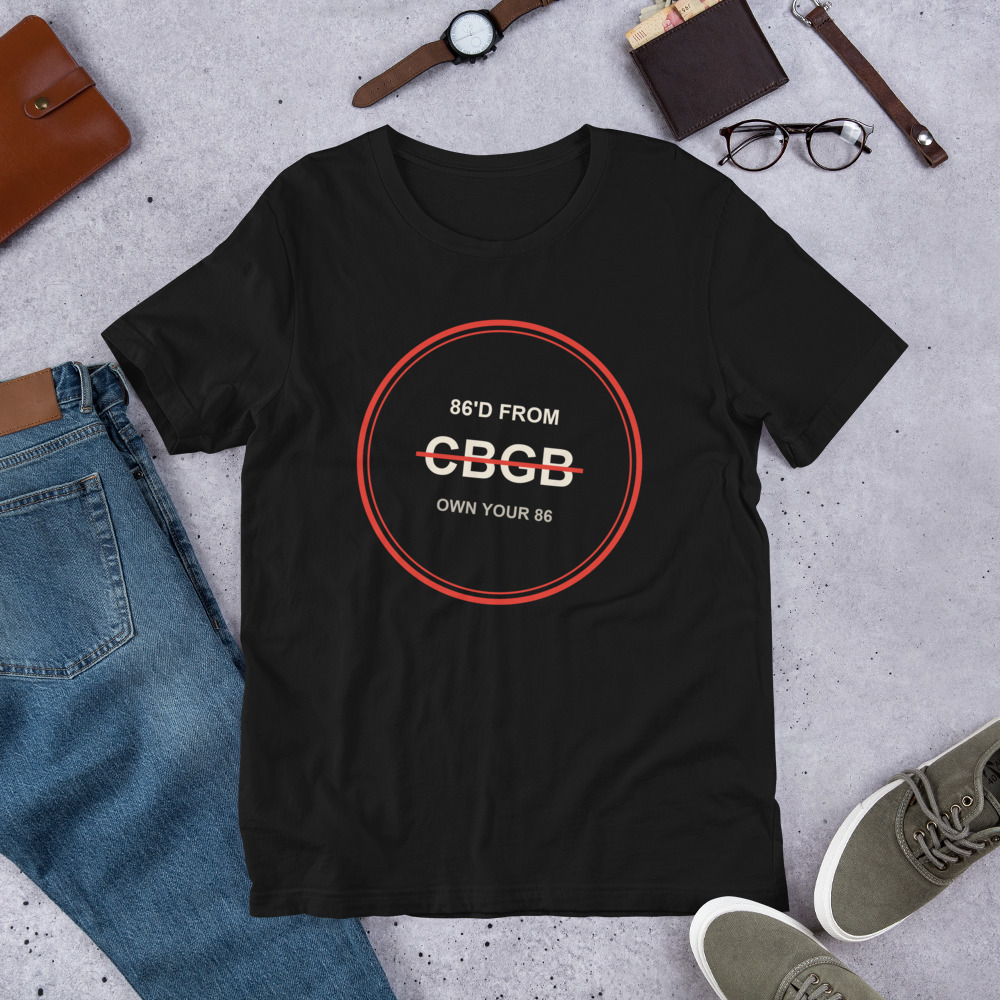 86FROM CBGB black tee in a flat-lay with jeans and accessories